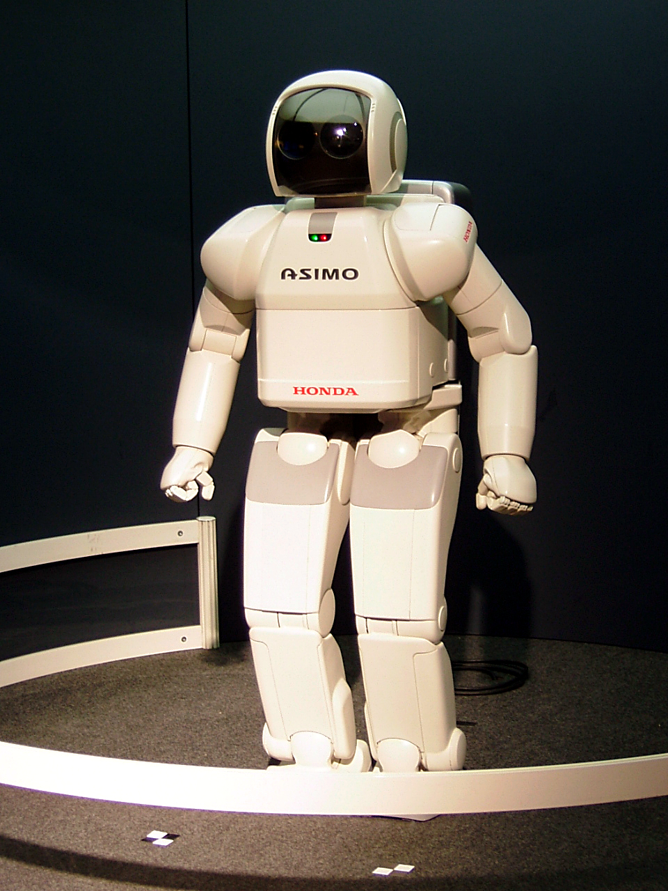 Honda's ASIMO humanoid robot standing on two legs.