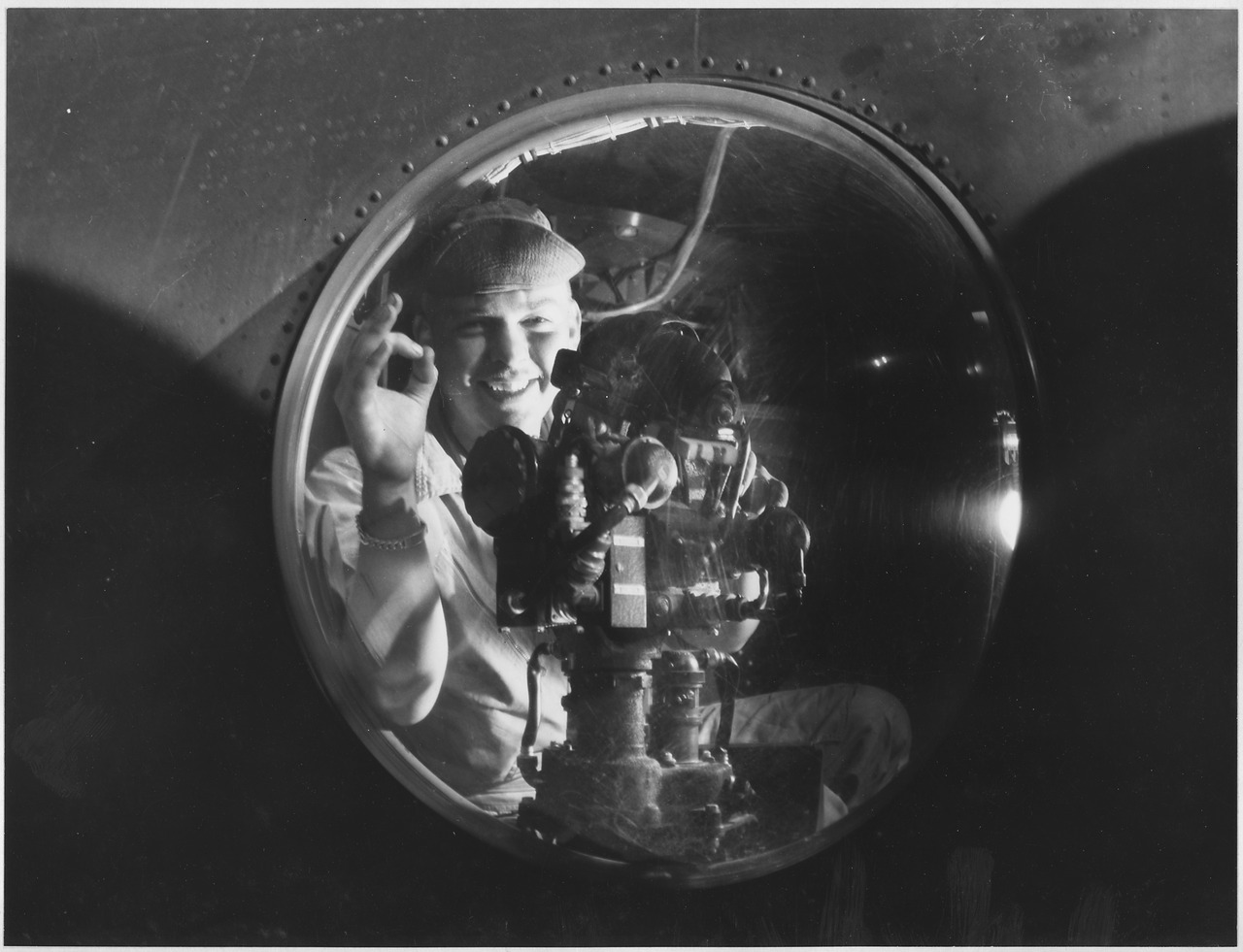 A US Army Air Forces aerial gunner at the gun blister of his bomber in World War II.