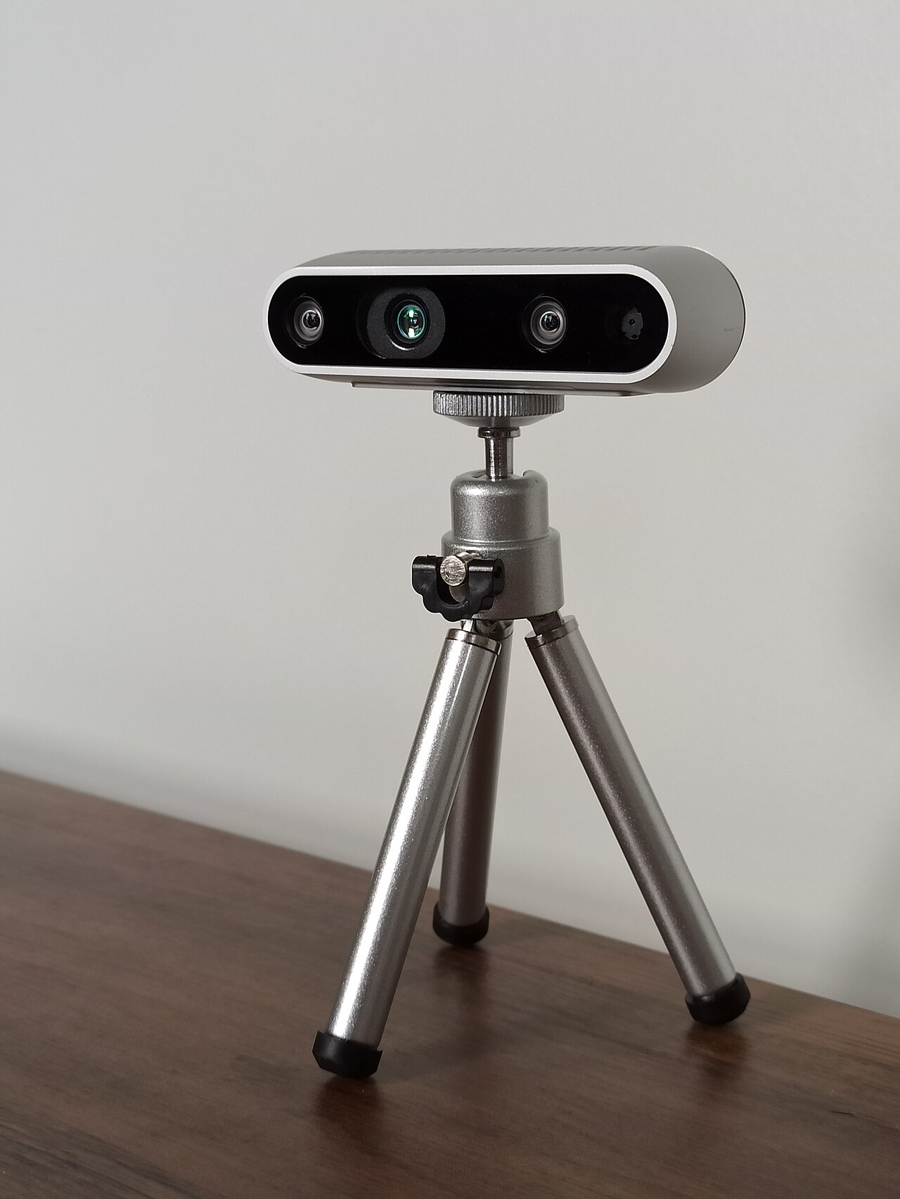 An Intel RealSense D435 stereo depth camera: a small bar with several lenses that measures distance to whatever is in front of it.