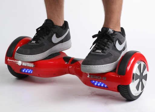 A self-balancing two-wheeled personal transporter (Segway-style) with a rider.
